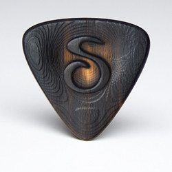 The Trinity series custom sculpted buffalo horn guitar pick is a triangular wedge shaped plectrum with greatly enhanced sound, feel and speed.