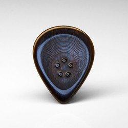 The Stubby series custom buffalo horn guitar pick is a little speed and soul monster. With a thinner recessed grip area and strong sharp edges this little plectrum monster is made for tight control with great dynamics.